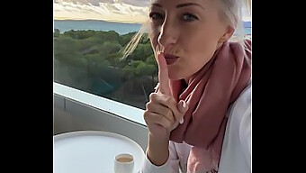 Alone blonde woman pleasures herself to climax on a balcony in a Mallorca hotel