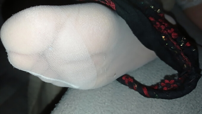 Amateur footjob with cum on wet pussy in stockings